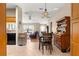 Open floor plan with tile flooring seamlessly connecting the dining and living area at 8732 Sw 60Th Cir, Ocala, FL 34476