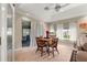 Bright dining area featuring tile floors, natural light, and outdoor views at 8732 Sw 60Th Cir, Ocala, FL 34476