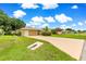 This home has a long drive and well-manicured lawn with mature landscaping and a two-car garage at 8732 Sw 60Th Cir, Ocala, FL 34476