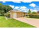 Home with a well-maintained lawn, mature landscaping, and a convenient attached two-car garage at 8732 Sw 60Th Cir, Ocala, FL 34476