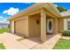 This home features a welcoming front entry, covered porch, and a convenient two-car garage at 8732 Sw 60Th Cir, Ocala, FL 34476