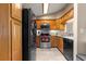 Kitchen boasting stainless steel appliances, tile flooring, and ample wooden cabinets at 8732 Sw 60Th Cir, Ocala, FL 34476