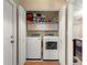 Laundry area featuring a newer washer and dryer inside of a closet with bi-fold doors at 8732 Sw 60Th Cir, Ocala, FL 34476
