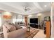 Comfortable living room area with a large television and cozy furnishings at 8732 Sw 60Th Cir, Ocala, FL 34476