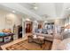 Spacious living room with a couch, tile flooring, and access to multiple rooms at 8732 Sw 60Th Cir, Ocala, FL 34476