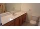 Bathroom featuring a vanity with a single sink, marble countertops, and a toilet at 8781 Sw 82Nd Court Rd, Ocala, FL 34481