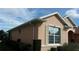 Exterior view of a peach home with white trim and well-maintained landscaping at 8781 Sw 82Nd Court Rd, Ocala, FL 34481