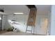 Well-lit garage with a pull-down attic access ladder at 8781 Sw 82Nd Court Rd, Ocala, FL 34481