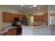 Kitchen featuring wooden cabinets, stainless steel appliances, and a breakfast bar at 8781 Sw 82Nd Court Rd, Ocala, FL 34481