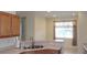 Kitchen sink area with wooden cabinets and breakfast bar, perfect for casual dining at 8781 Sw 82Nd Court Rd, Ocala, FL 34481