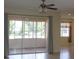 Living room view to the screened in patio with large sliding glass doors at 8781 Sw 82Nd Court Rd, Ocala, FL 34481