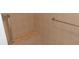Tiled shower stall offering a built-in seat and grab bar for accessibility and convenience at 8781 Sw 82Nd Court Rd, Ocala, FL 34481
