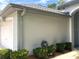 Exterior view of the house, showcasing the attached garage and well-maintained landscaping at 9328 Sw 192Nd Court Rd, Dunnellon, FL 34432