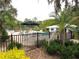 A refreshing community pool with a picnic umbrella and comfortable chairs at 9328 Sw 192Nd Court Rd, Dunnellon, FL 34432