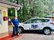 A security guard and security vehicle outside a guard station for the community at 9328 Sw 192Nd Court Rd, Dunnellon, FL 34432