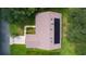 Aerial view of a home with solar panels, a landscaped yard, and a tidy roof at 95 Hickory Loop, Ocala, FL 34472