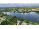 Beautiful aerial view of a lakeside community with lush green landscaping and serene waterfront homes at 95 Hickory Loop, Ocala, FL 34472
