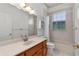 Well-lit bathroom with a light wood vanity, and a shower-tub combination at 95 Hickory Loop, Ocala, FL 34472