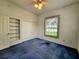 Bedroom with a ceiling fan, window, and closet at 95 Hickory Loop, Ocala, FL 34472