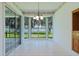 Sun-drenched breakfast nook with bay windows offers stunning waterfront views and ample natural light at 95 Hickory Loop, Ocala, FL 34472