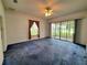Spacious living room with sliding glass doors to the lanai at 95 Hickory Loop, Ocala, FL 34472