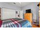 Bedroom features a double door closet and a window for natural lighting at 9551 Sw 92Nd Ter, Ocala, FL 34481
