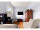 Bedroom features a window, a black TV, and a comfortable reclining chair at 9551 Sw 92Nd Ter, Ocala, FL 34481