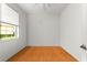 Bright bedroom with hardwood floors, window with blind, and a ceiling fan at 9551 Sw 92Nd Ter, Ocala, FL 34481
