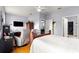 Bedroom features a door leading to a walk-in closet and a reclining chair at 9551 Sw 92Nd Ter, Ocala, FL 34481