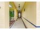 Covered entryway featuring tiled flooring and decorative pillars, creating a welcoming entrance at 9551 Sw 92Nd Ter, Ocala, FL 34481