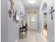 Welcoming foyer with tile floors, archway, and a decorative accent table at 9551 Sw 92Nd Ter, Ocala, FL 34481