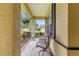 Cozy front porch with seating, providing a relaxing outdoor space with garden views at 9551 Sw 92Nd Ter, Ocala, FL 34481