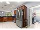 Kitchen with stainless steel appliances, dark cabinets, and granite countertops at 9551 Sw 92Nd Ter, Ocala, FL 34481