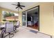 Cozy screened-in patio with comfortable seating and an open view into the living area at 9551 Sw 92Nd Ter, Ocala, FL 34481