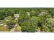Aerial view showcases property boundary and the surrounding lush green tree coverage at 986 Se 57Th Ave, Ocala, FL 34480
