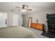 Spacious bedroom featuring natural light, ceiling fan, and carpeted floors at 986 Se 57Th Ave, Ocala, FL 34480