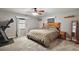 Serene bedroom featuring a wooden-frame bed and a ceiling fan at 986 Se 57Th Ave, Ocala, FL 34480