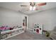 Bonus room with carpet flooring, ceiling fan, and versatile layout for a playroom or living space at 986 Se 57Th Ave, Ocala, FL 34480