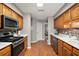 Classic kitchen with wooden cabinetry, stainless steel appliances, and white countertops at 986 Se 57Th Ave, Ocala, FL 34480