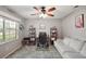 Office space with a bright window, neutral walls, carpeted floors, and comfortable seating at 986 Se 57Th Ave, Ocala, FL 34480