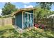 Well-maintained outdoor shed with double doors, offering ample storage space for your tools and equipment at 986 Se 57Th Ave, Ocala, FL 34480