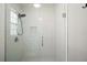 Modern shower with white subway tiles and a glass door at 986 Se 57Th Ave, Ocala, FL 34480