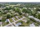 An aerial view of a residential community featuring well-maintained homes and lush green landscaping at 10012 Sw 88Th Ct, Ocala, FL 34481