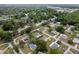 An aerial of a quiet residential neighborhood with mature trees and well-maintained properties at 10012 Sw 88Th Ct, Ocala, FL 34481