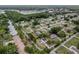 This aerial view showcases the community's layout with tree-lined streets and well-maintained homes at 10012 Sw 88Th Ct, Ocala, FL 34481