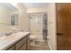 Bathroom featuring a long vanity with modern faucet, toilet, and shower/tub combo at 10012 Sw 88Th Ct, Ocala, FL 34481