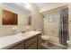Bathroom featuring a long vanity with modern faucet, toilet, and shower/tub combo at 10012 Sw 88Th Ct, Ocala, FL 34481