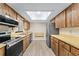 Functional kitchen with stainless steel appliances and plenty of cabinet space at 10012 Sw 88Th Ct, Ocala, FL 34481