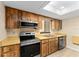 Well-equipped kitchen featuring stainless steel appliances and ample cabinet storage at 10012 Sw 88Th Ct, Ocala, FL 34481