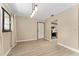 Living room with updated floors, and view of the kitchen at 10012 Sw 88Th Ct, Ocala, FL 34481
